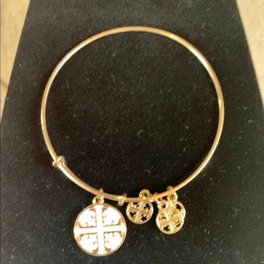 Tory Burch red/gold and white/gold with three gold charms bracelet